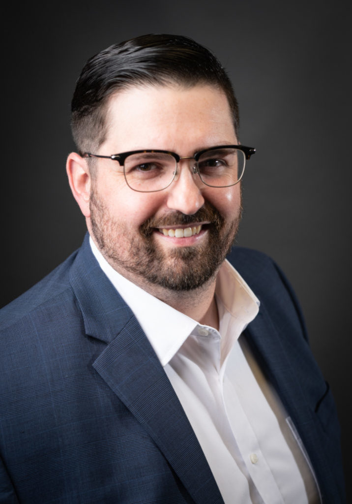 The Communications Group Headshot of Casey Baker